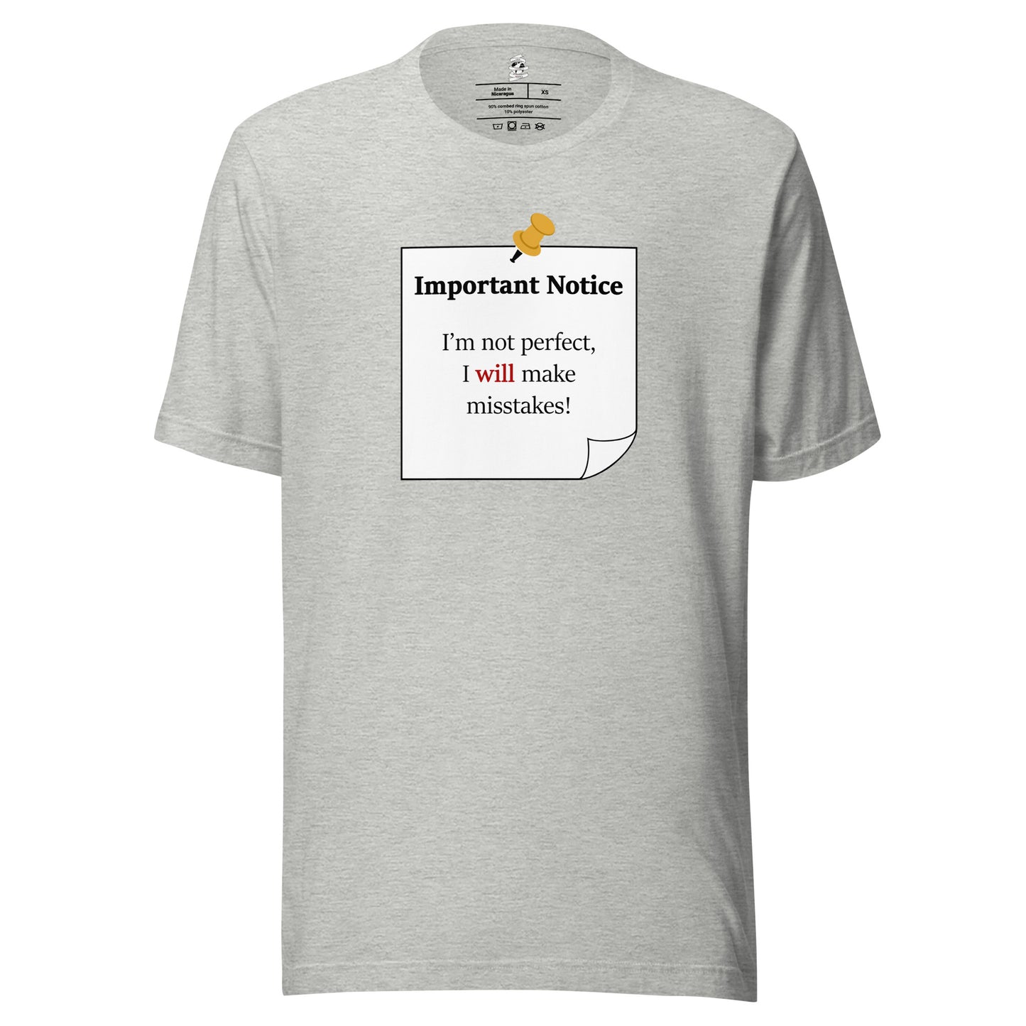 A unisex athletic-heather grey classic cotton t-shirt featuring a printed black-outlined square note with a white background and a yellow pushpin at the top centre. The note displays the slogan: "Important notice: I’m not perfect, I will make mistakes" in black, with the word will highlighted in bold red for emphasis.