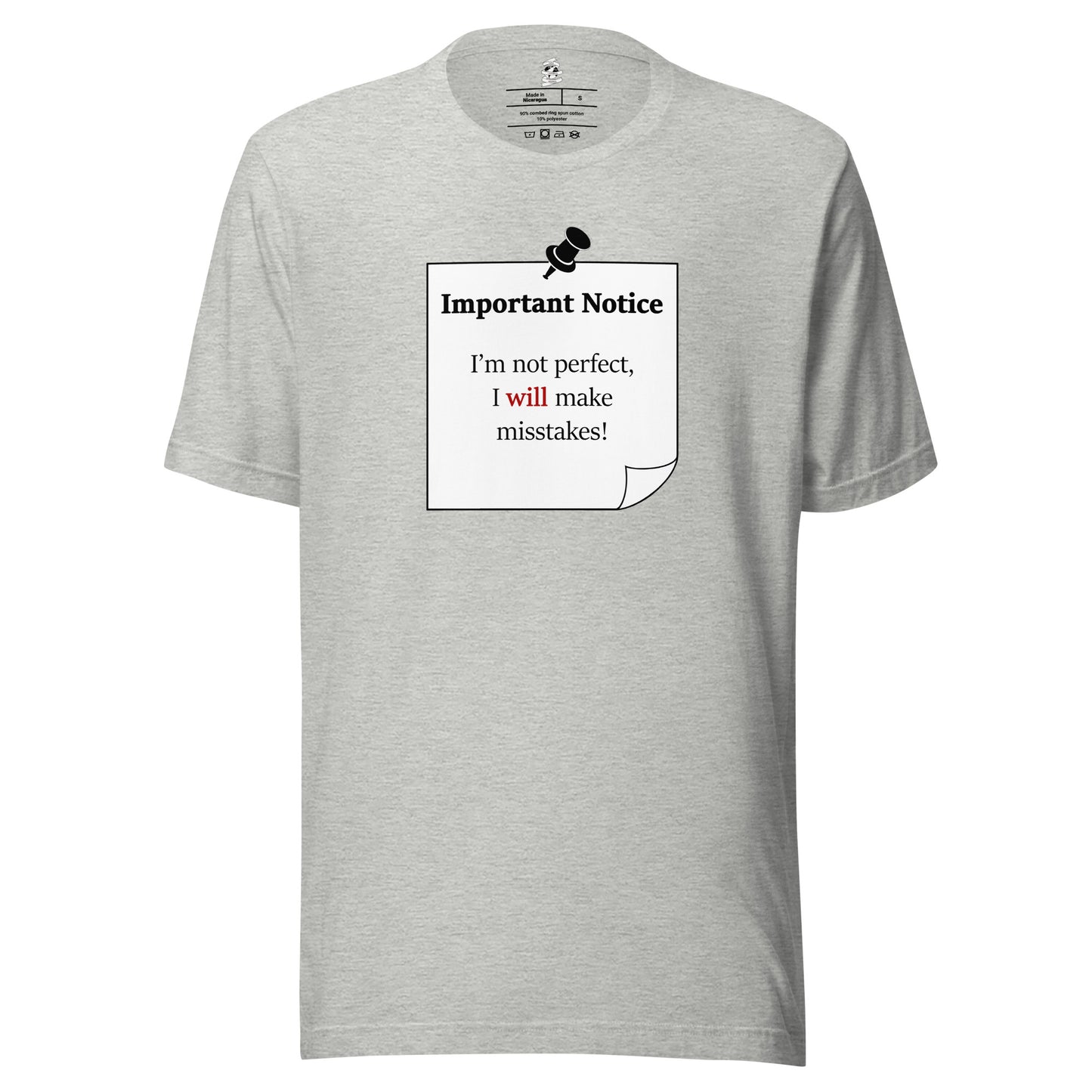 A unisex athletic-heather grey classic cotton t-shirt featuring a printed featuring a printed black-outlined square note with a white background and a black pushpin at the top centre. The note displays the slogan: "Important notice: I’m not perfect, I will make mistakes" in black, with the word will highlighted in bold red for emphasis.
