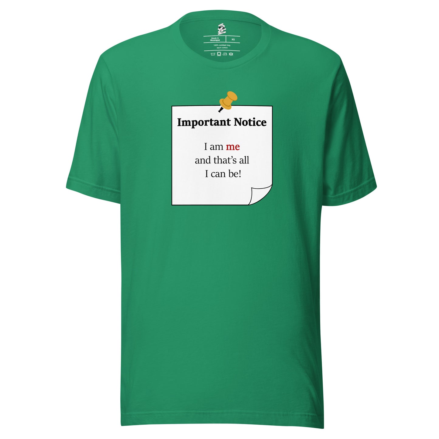 A unisex classic cotton Kelly green t-shirt featuring a printed black-outlined square note with a white background and a yellow pushpin at the top centre. The note displays the slogan: "Important notice: I am me that's all I can be" in black, with the word me highlighted in bold red for emphasis.