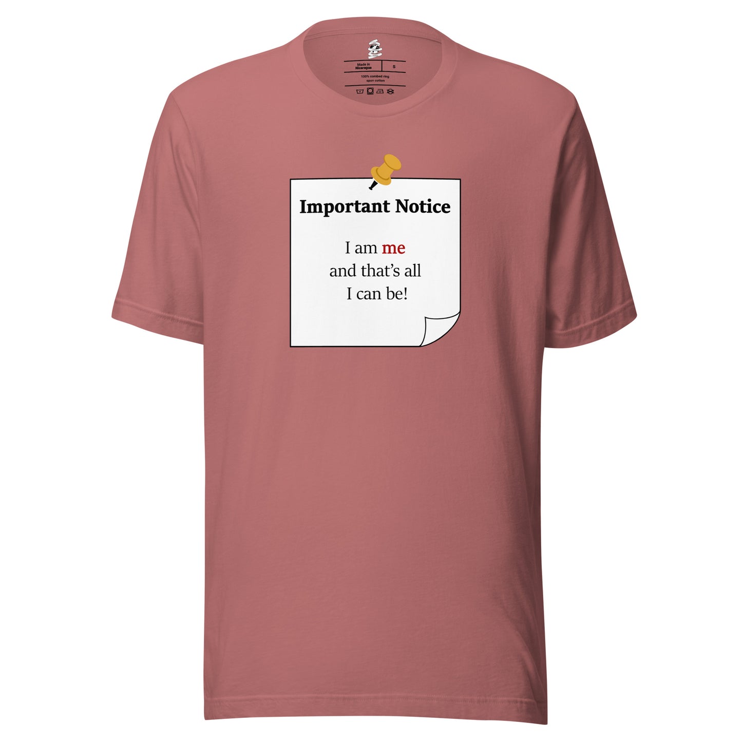 A unisex classic cotton mauve t-shirt featuring a printed black-outlined square note with a white background and a yellow pushpin at the top centre. The note displays the slogan: "Important notice: I am me that's all I can be" in black, with the word me highlighted in bold red for emphasis.