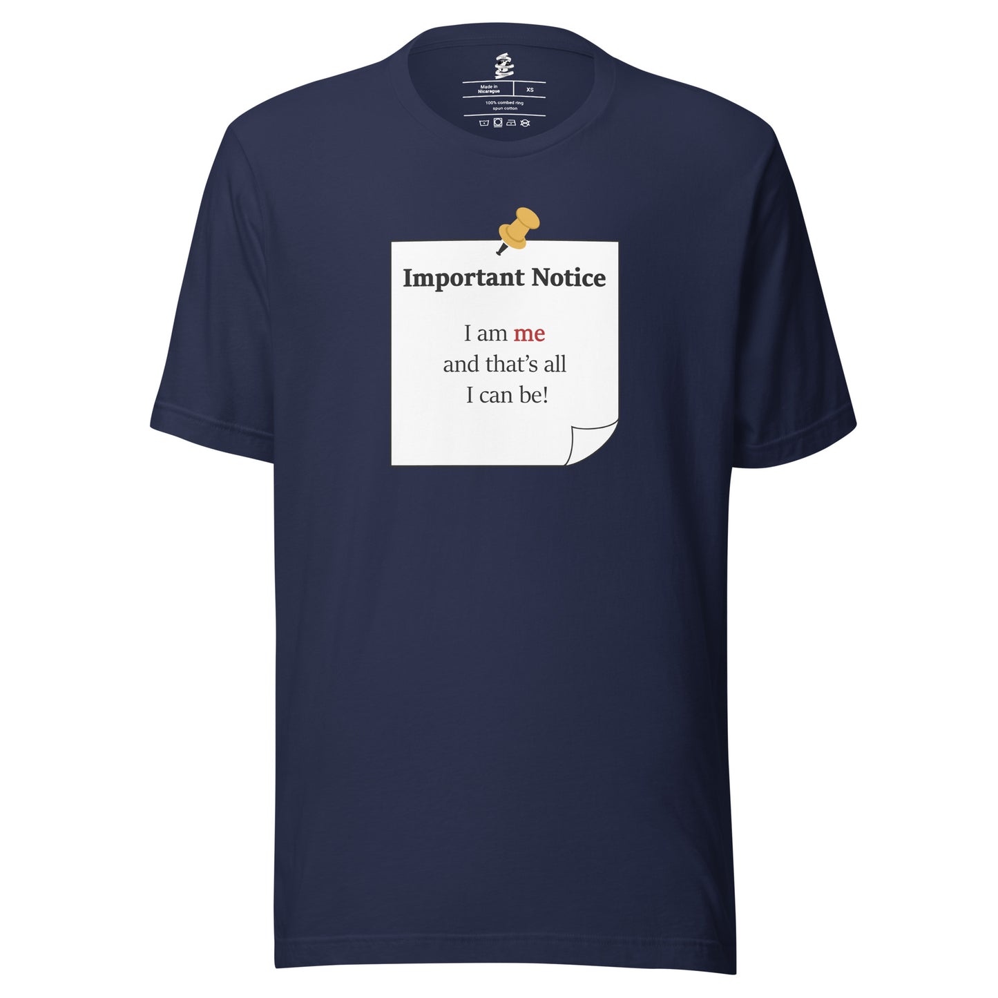 A unisex classic cotton navy t-shirt featuring a printed black-outlined square note with a white background and a yellow pushpin at the top centre. The note displays the slogan: "Important notice: I am me that's all I can be" in black, with the word me highlighted in bold red for emphasis.