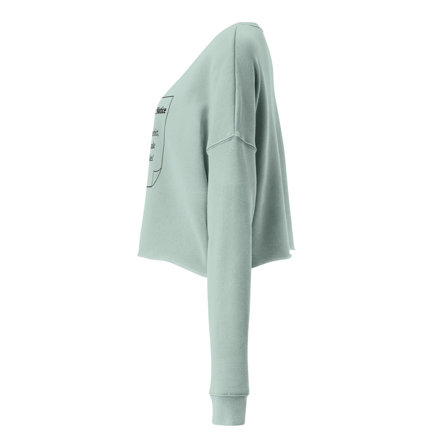 The side view of a woman’s cropped fleece dusty blue sweatshirt jumper.