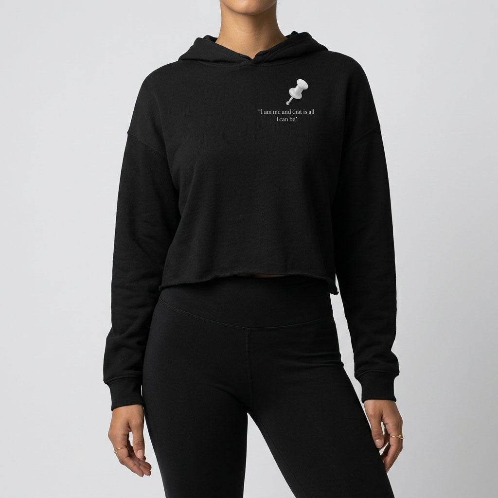 A woman in black jeans wearing a black crop hooded jumper featuring a white-outlined square note with a white push pin. The note displays the slogan: 'Important Notice: I’m not perfect, I will make mistakes,' with 'will' in bold red for emphasis.
