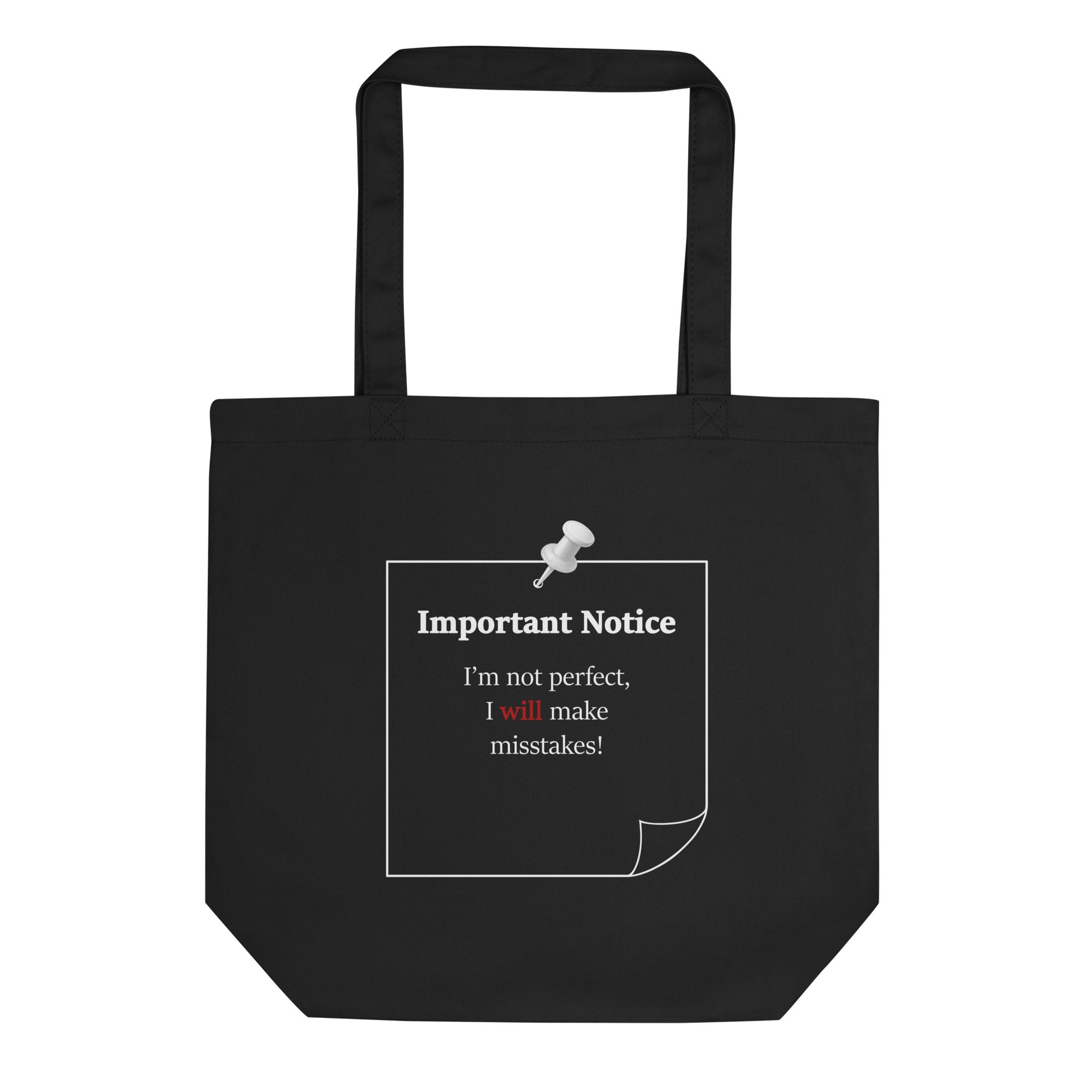 Black organic cotton tote bag featuring a pinned note graphic with the affirmation “Important Notice: I'm not perfect, I will make mistakes” and a white drawing pin illustration.