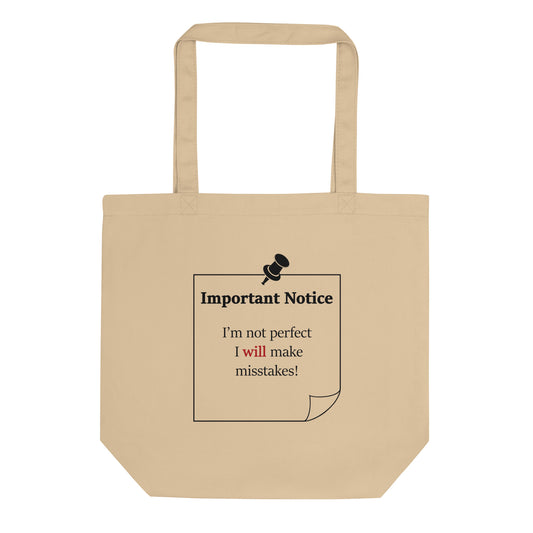 A small organic cotton twill oyster colour tote featuring a printed black outlined square note and a black pushpin at the top centre. The note displays the slogan: "Important notice: I’m not perfect, I will make mistakes" in black, with the word will highlighted in bold red for emphasis.