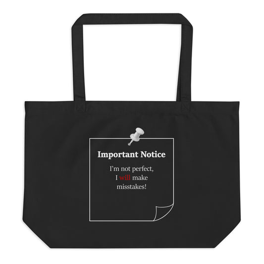 Black organic cotton tote bag with “Important Notice I’m not perfect I will make mistakes” statement slogan