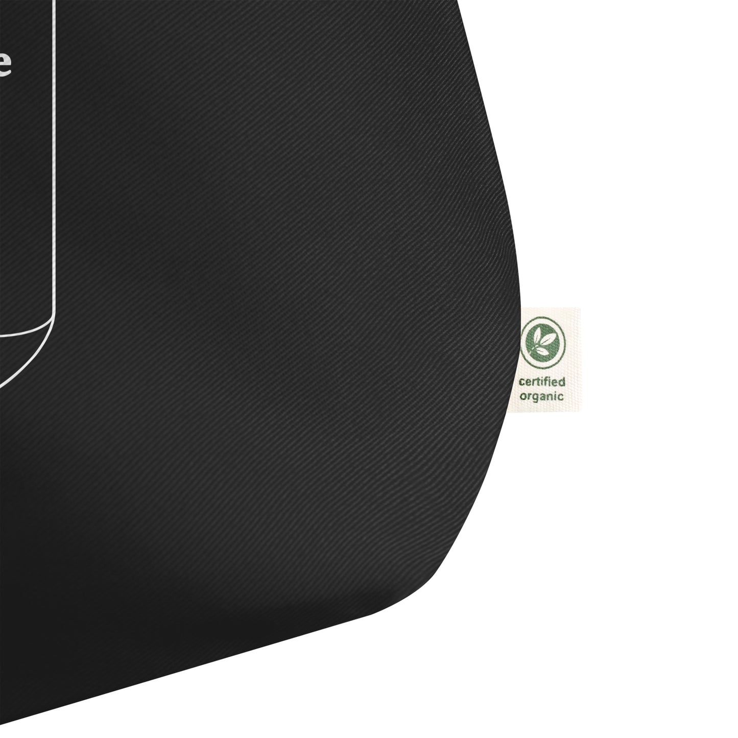 Black tote bag with a certified organic label on a white background.