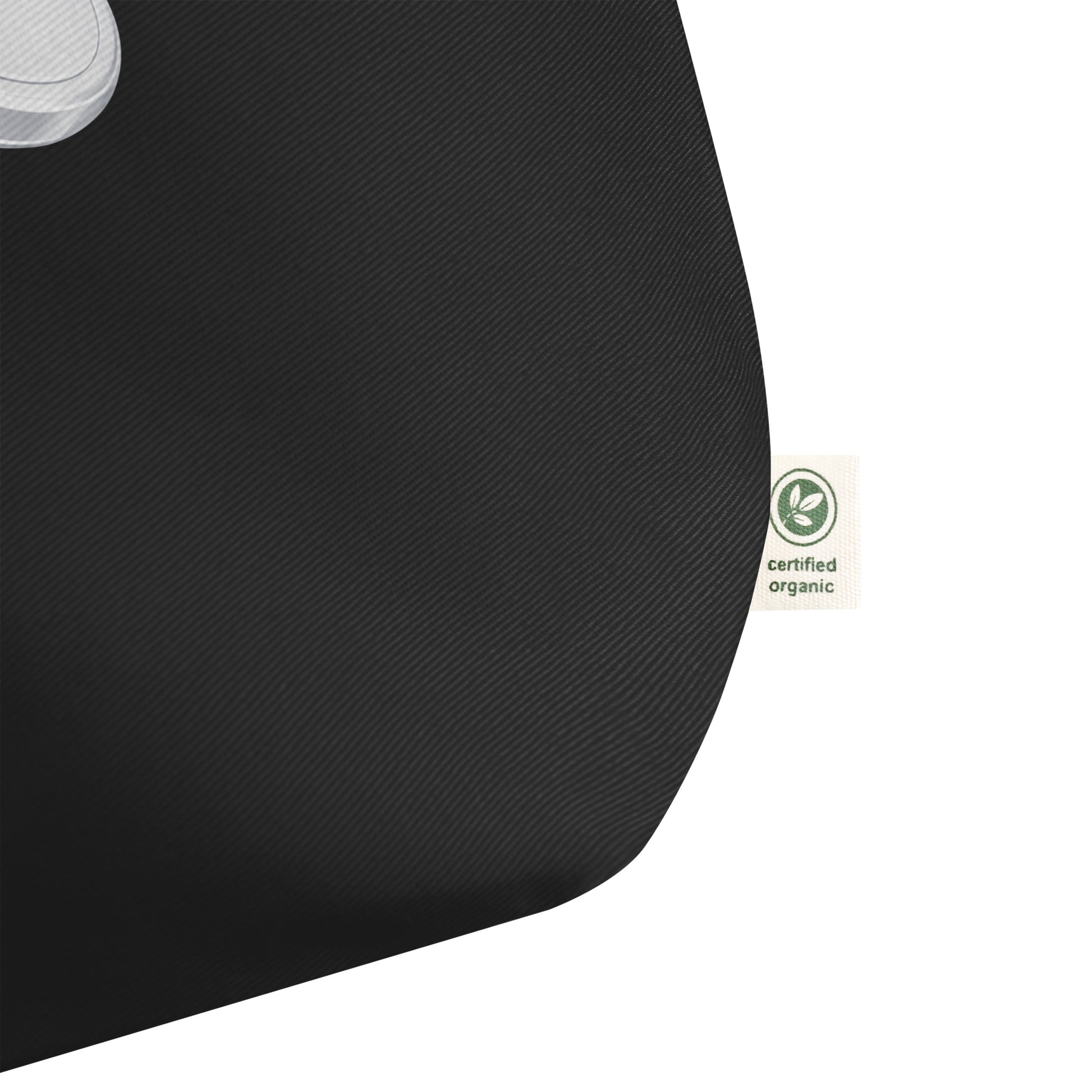 Black tote bag with a certified organic label on a white background.
