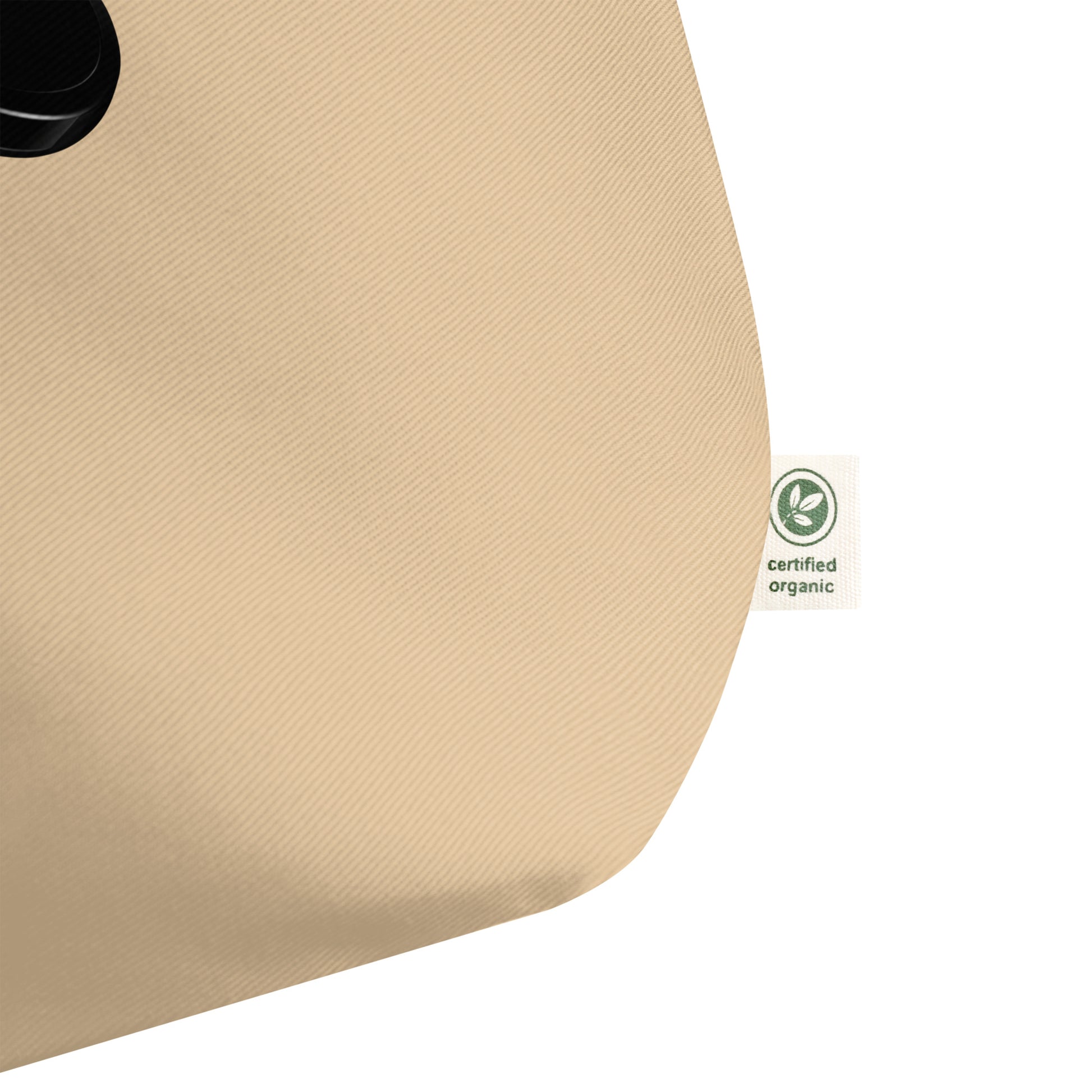 Oyster Beige tote with a certified organic label on the corner of the shopper bag. 