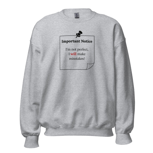 A unisex crew neck classic  sport grey jumper, featuring a printed black outlined square note and a black pushpin at the top centre. The note displays the slogan: "Important notice: I’m not perfect, I will make mistakes" in black, with the word will highlighted in bold red for emphasis.