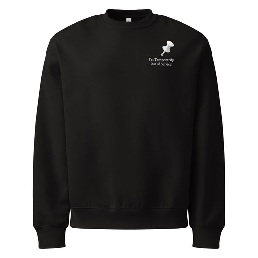 Black oversized heavyweight sweatshirt with “I’m temporarily out of service” white slogan graphic.