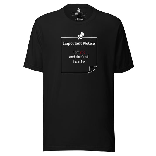 A unisex black classic cotton t-shirt featuring a printed white-outlined square note and a white pushpin at the top centre. The note displays the slogan: "Important notice: I am me and that's all I can be" in black, with the word me highlighted in bold red for emphasis.