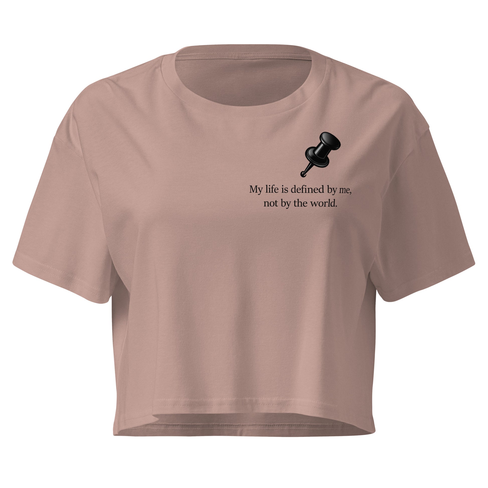 Hazy pink colour women's crop top featuring a black push pin graphic and the statement “My life is defined by me, not by the world” graphic design 