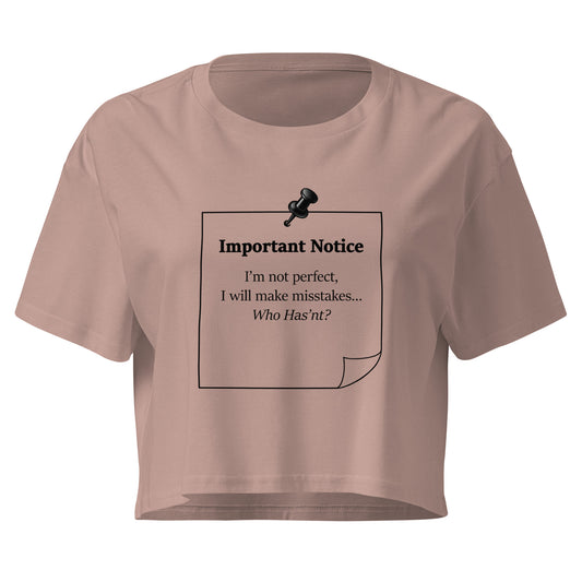 Hazy pink women's crop top featuring a black note and black push pin graphic with the statement “I'm not perfect, I will make mistakes” in a minimalist design