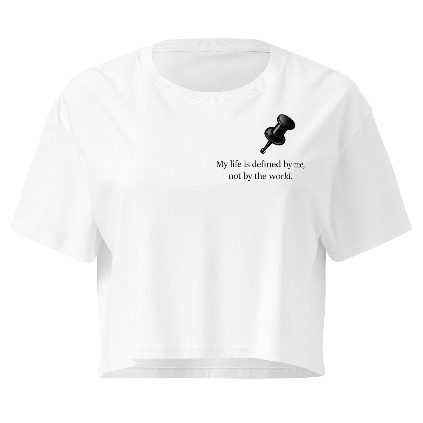 White women's crop top featuring a black push pin graphic and the statement “My life is defined by me, not by the world” graphic design 