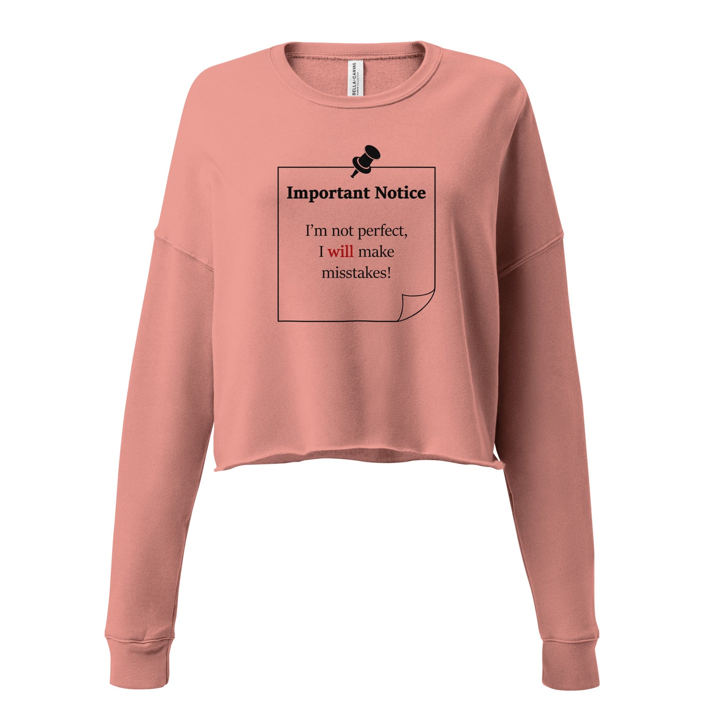 A woman’s cropped fleece mauve sweatshirt jumper featuring a printed black outlined square note and a black pushpin at the top centre. The note displays the slogan: "Important notice: I’m not perfect, I will make mistakes" in black, with the word will highlighted in bold red for emphasis.